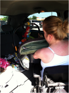 photo of mother unloading baby from car with one arm