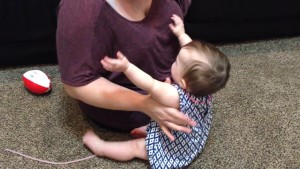 Demonstrates how to lift a baby with one arm video thumbnail