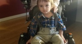 Transporting toddler on wheelchair footrest