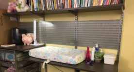 Adjustable baby changing table and book shelf