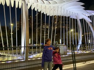 Author's kids posing by an art installation